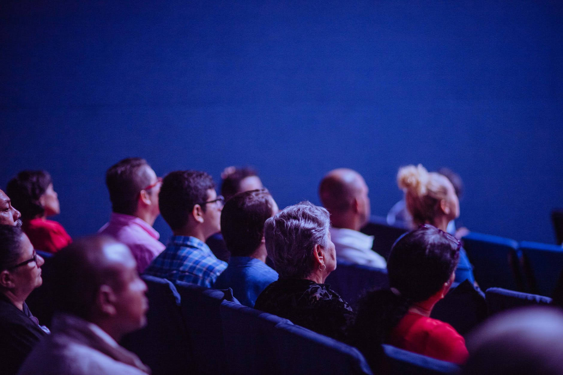 People Sitting on Chairs at Conferance